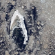 Earth from space: Iconic 'Star Trek' symbol shines brightly in sea of muddy Arctic sea ice