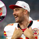 Why Travis Kelce Wore a ‘Silly’ Mascot Head on ‘New Heights’ — And How Patrick Mahomes Is Involved