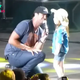 Luke Bryan accompanied by an enthusiastic young fan on stage who sings along to every word!