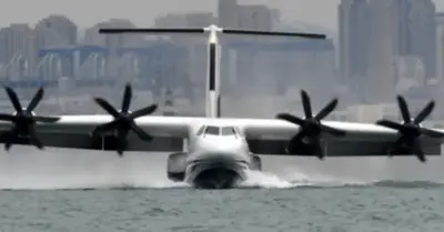 The largest seaplane in the world takes off on its first flight over water