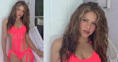 Shakira shows off the H๏τ pink ʙικιɴι she designed herself as she models fringe bathing suit for fans