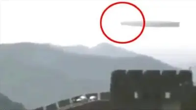 Large, Long Tubular Craft Slowly Gliding Over China’s Great Wall