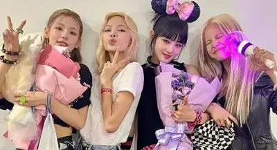Minnie, Miyeon, BLACKPINK’s Lisa, and Sorn are all smiles backstage at Day 2 of (G)I-DLE’s Seoul concerts