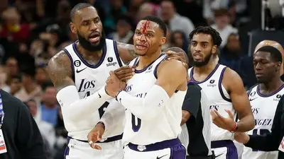 Profusely bleeding Russell Westbrook restrained by LeBron James after flagrant foul by Spurs' Zach Collins