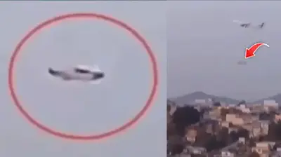 A UFO Hovers Over A City In Mexico As A Plane Flies Past