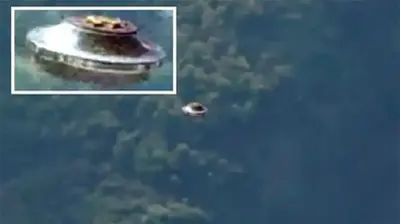 Silver UFO Filmed Over Molokai, Hawaii
