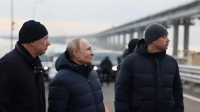 Russia's Putin drives across repaired bridge to Crimea