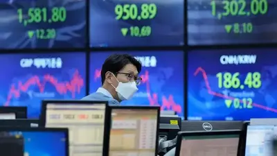 Asian markets follow Wall St lower amid gloomy outlook