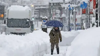 Snow piles deep in northern Japan, strands vehicles, 3 dead