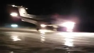 Alaskans use vehicles to light up dark runway so medevac flight can land