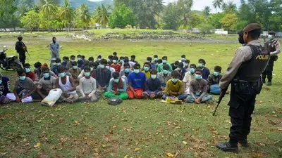 58 Rohingya Muslims land on beach in Indonesia's Aceh