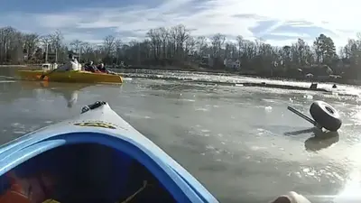 Father-and-son kayakers rescue pilot who crash-landed in icy creek