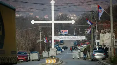 Kosovo reopens Serbia border crossing, roadblocks yet to go