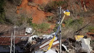 Troops join search for missing in northern Japan landslide
