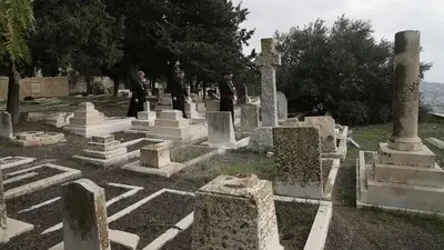 Israel police arrest 2 teens in attack on Christian cemetery
