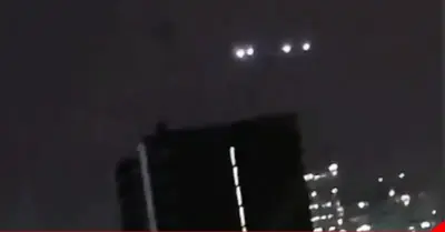 Eyewitnesses see amazing UFOs about 4 UFOs on the Chilean Skyscraper