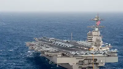 13 trillion dollars With room for 75 aircraft, the Gerald R. Ford is the largest aircraft carrier in the world.