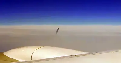 Mysterious Unidentified Object Was Seen Right Above The Clouds And Freaked Out Airline Passengers