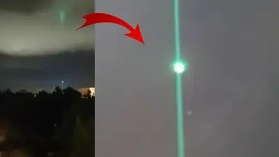 UFO With A Green Laser Shoots Across The City (video)