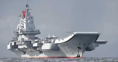 View The Liaoning, China’s first aircraft carrier, as it cruises while adorned with 24 J-15 jets to celebrate its birthday
