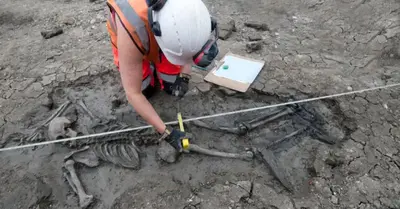 Archaeologists in London discovered a medieval man’s skeleton wearing his shoes during excavations