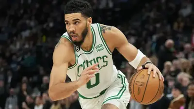 Celtics' Jayson Tatum takes nasty fall from flagrant foul after dunking on Wolves' Rudy Gobert