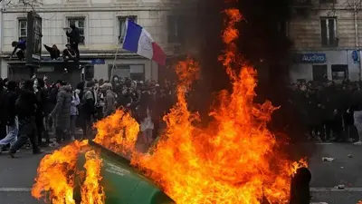Paris trash strike ends, pension protest numbers shrink