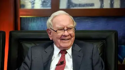 Warren Buffett's firm ups stakes in Japanese trading houses