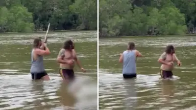 Queensland men slammed for wading into croc-infested waters at Cape York with a gun
