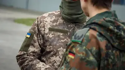 Military honors for Ukrainian president as he visits Germany to discuss arms deliveries