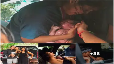 Dad catches the newborn in his arms as Mom gives birth in the backseat of the car