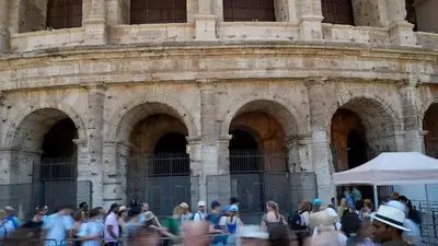Italian police say the man filmed carving his name on the Colosseum is a tourist living in Britain