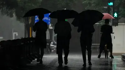 Beijing records heaviest rainfall in at least 140 years, causing severe flooding and 21 deaths