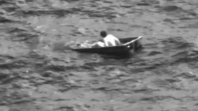 Man rescued from partially submerged jon boat after more than 24 hours out at sea