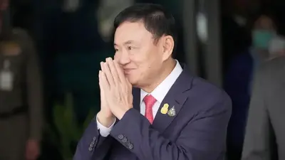 Thailand's king reduces former Prime Minister Thaksin's 8-year prison term to a single year