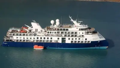 A fishing vessel in Greenland will try to free a cruise ship that ran aground with 206 people