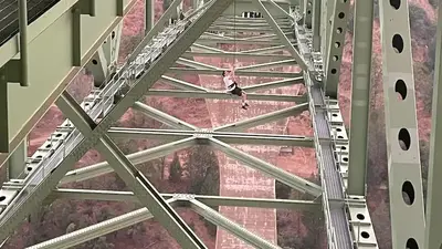 Man rescued dangling from California's highest bridge 700 feet above river