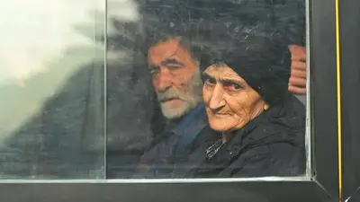 Thousands flee disputed enclave in Azerbaijan after ethnic Armenians laid down arms