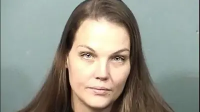 Mother leaves her 2 babies inside idling unlocked car while she goes to a bar