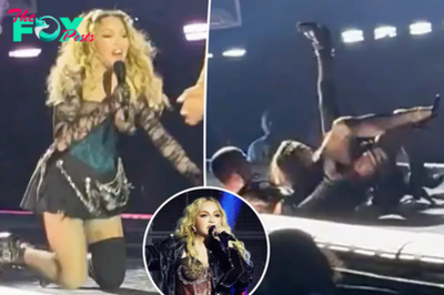 Madonna falls backwards in her chair during Seattle concert