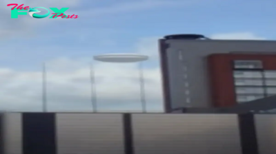 qq The photo shows a white UFO moving through buildings in Candler, NC