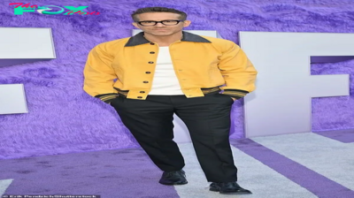 dq Ryan Reynolds rocks a sleek look, wearing glasses and a yellow bomber jacket as he confidently walks the red carpet solo at the IF premiere in New York City