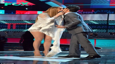 dq The kiss was only a kiss! Marc Anthony attempts to demonstrate Jennifer Lopez kiss at Latin Grammys was blameless as he puckers up to his buddies