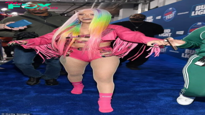 rin Cardi B captures everyone’s attention with a ribald pink calfskin outfit and rainbow hair as she leads stars at Bud Light Super Bowl Music Fest