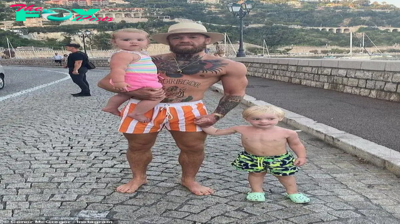 C5/Conor McGregor is every inch the doting father as he enjoys quality time with his children Conor Jr, 2, and Croia, 19 months, on family holiday in the South of France!