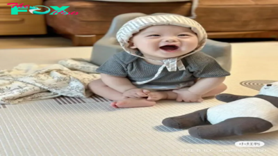 The baby’s bright, innocent and adorable smile is a sight that melts many hearts. With sparkling eyes and a big grin, the pure joy and pure happiness captured in this moment reminds us of the simple joys in life.