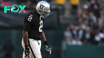Why was former NFL player JaMarcus Russell fired as a high school football coach?