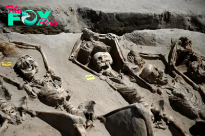 B83.Grim Discovery in Greek Cemetery: Archaeologists Unearth 80 Skeletons Bound by Iron Chains