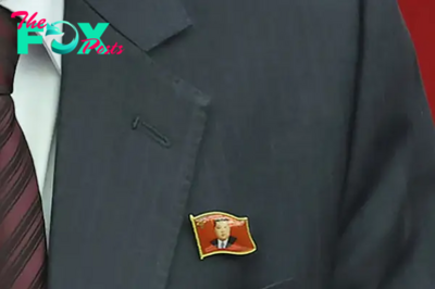 North Koreans Are Now Wearing Kim Jong Un Pins as His Personality Cult Grows