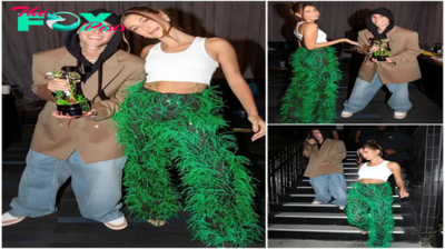 rin Hailey Bieber Sets Fashion Ablaze With Feather-Flared Jeans, Green Feathers Sprout From Dark Denim, Sparking New Trend